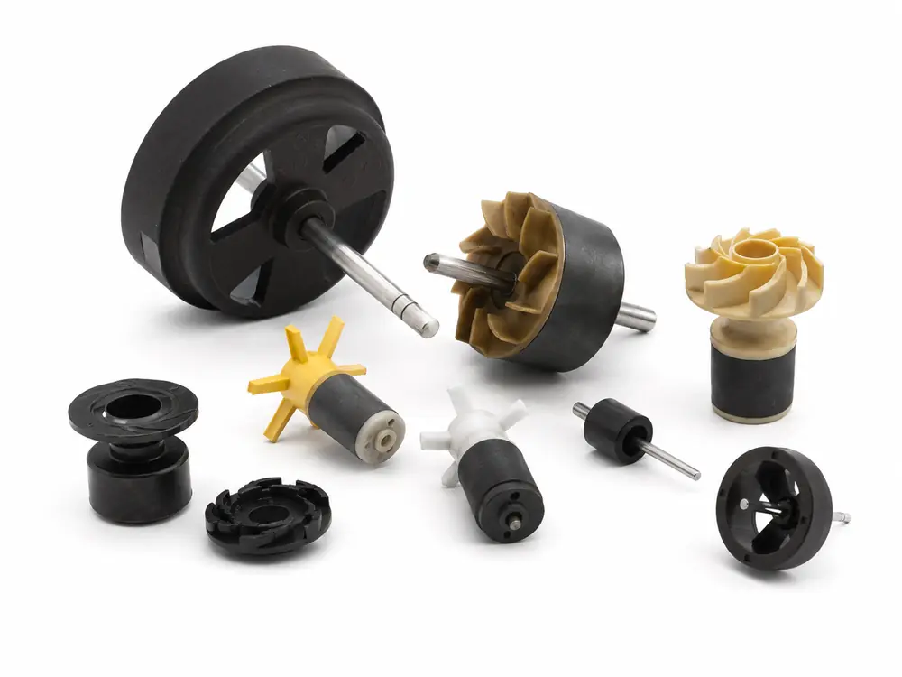 Bonded magnet rotor with controlled pole layout