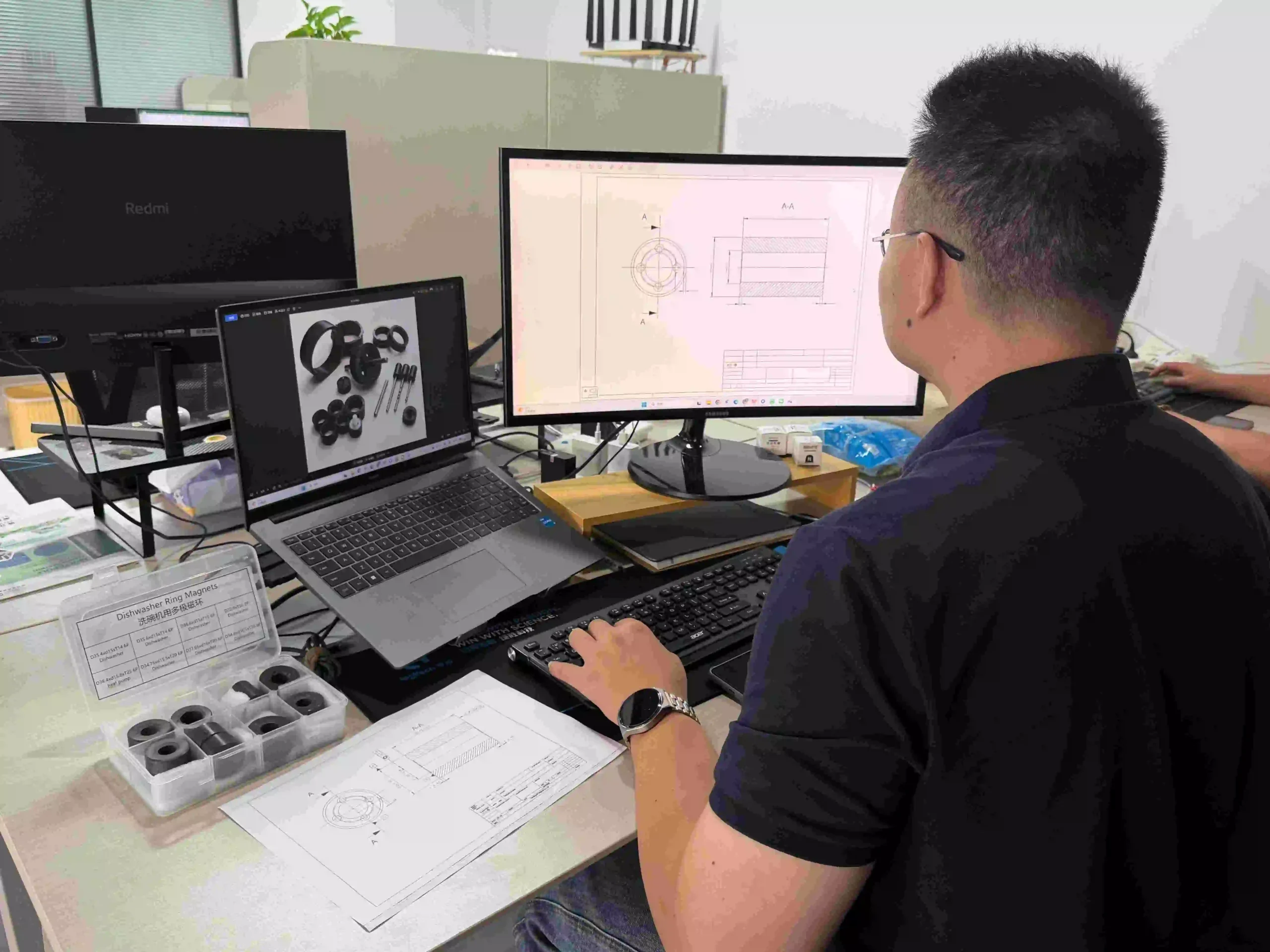 Engineer reviewing a custom ring magnet drawing